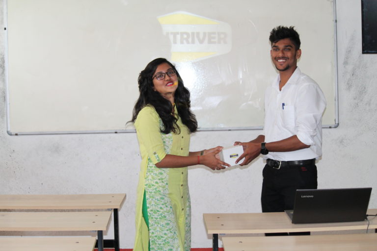 Supervisor Salman awarding Intern Sushmitha