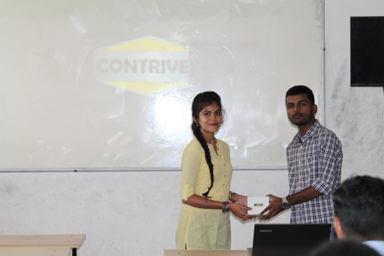 Supervisor Kiran awarding Intern Prabha U